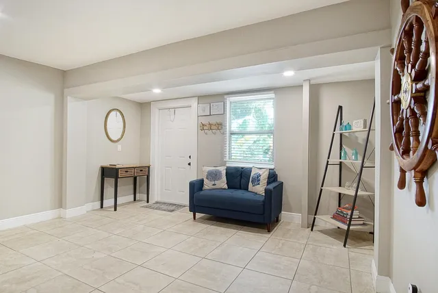 a living room with furniture and a window