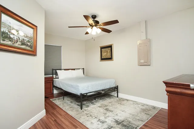 a room with pool table and a window