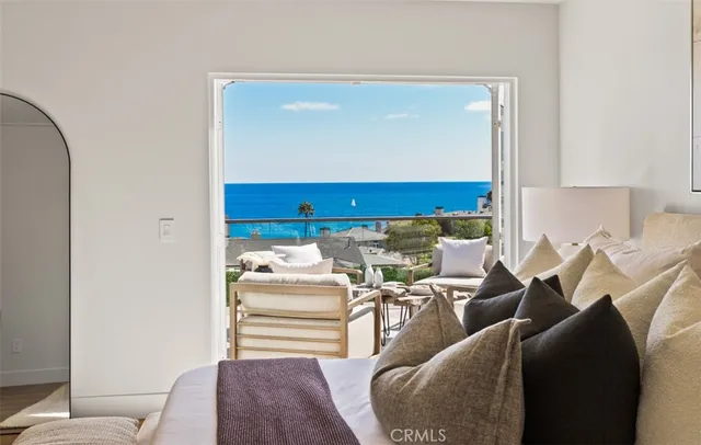 a living room with furniture and a mirror
