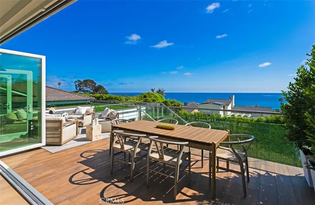 a view of a chairs and table in the patio