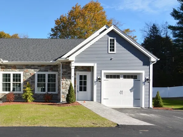 a view of a house with backyard and porch