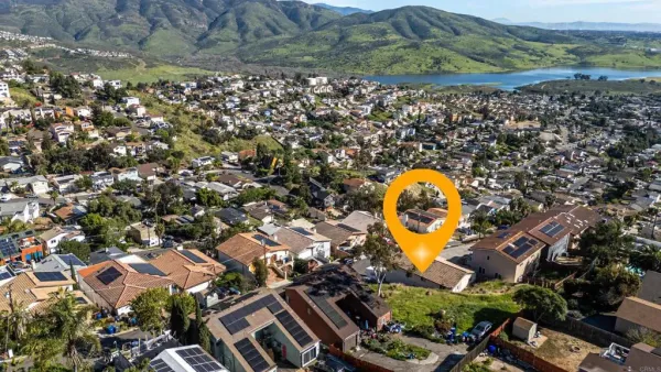 an aerial view of a house with a swimming pool outdoor seating and yard