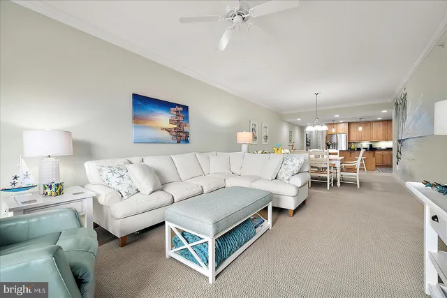 a kitchen with stainless steel appliances granite countertop a kitchen island hardwood floor sink and stove