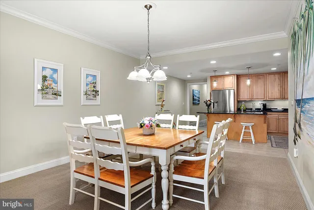 a view of a dining room and livingroom furniture and chandelier