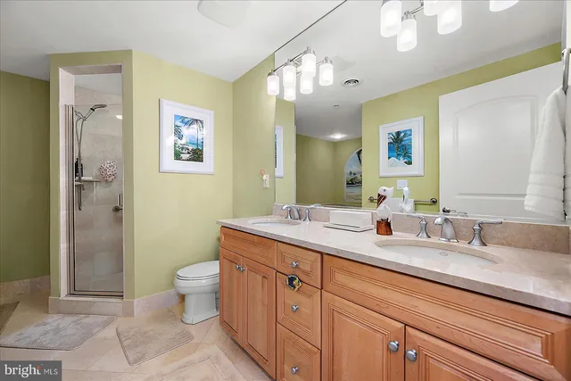 a bedroom with two beds and a window