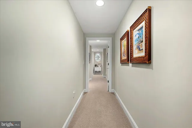 a view of a hallway with a white walls