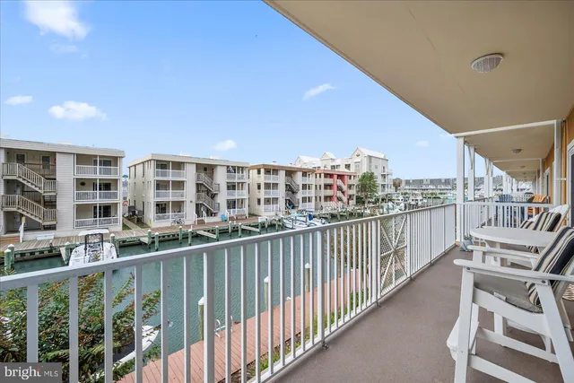 a view of residential house with outdoor space and lake view