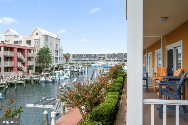 a view of a kitchen with kitchen island and a sink