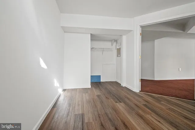 a view of wooden floor in an empty room