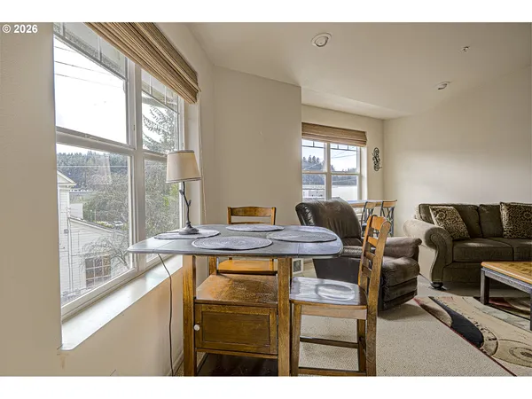 a view of a workspace room with a window