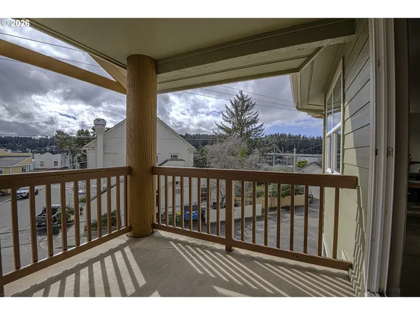 a view of balcony with wooden floor
