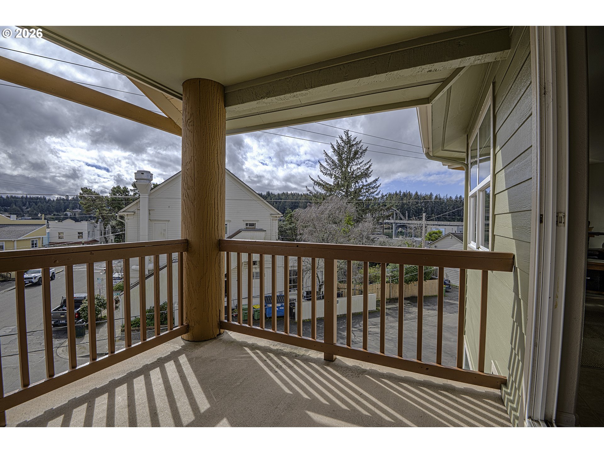 179 Laurel Street, Unit 9 Florence, OR 97439 - Photo 20 of 37 a view of balcony with wooden floor