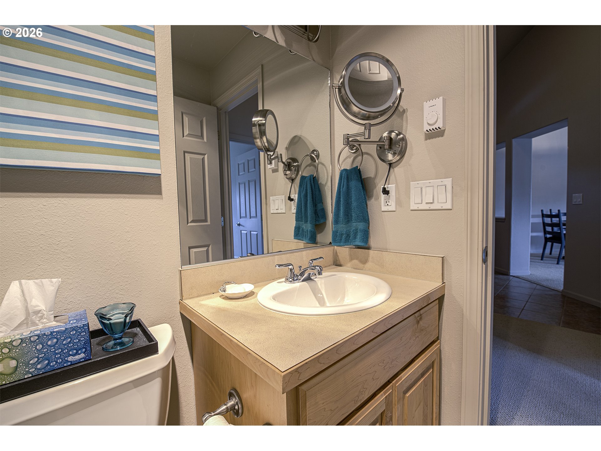 179 Laurel Street, Unit 9 Florence, OR 97439 - Photo 32 of 37 a bathroom with a sink and a mirror