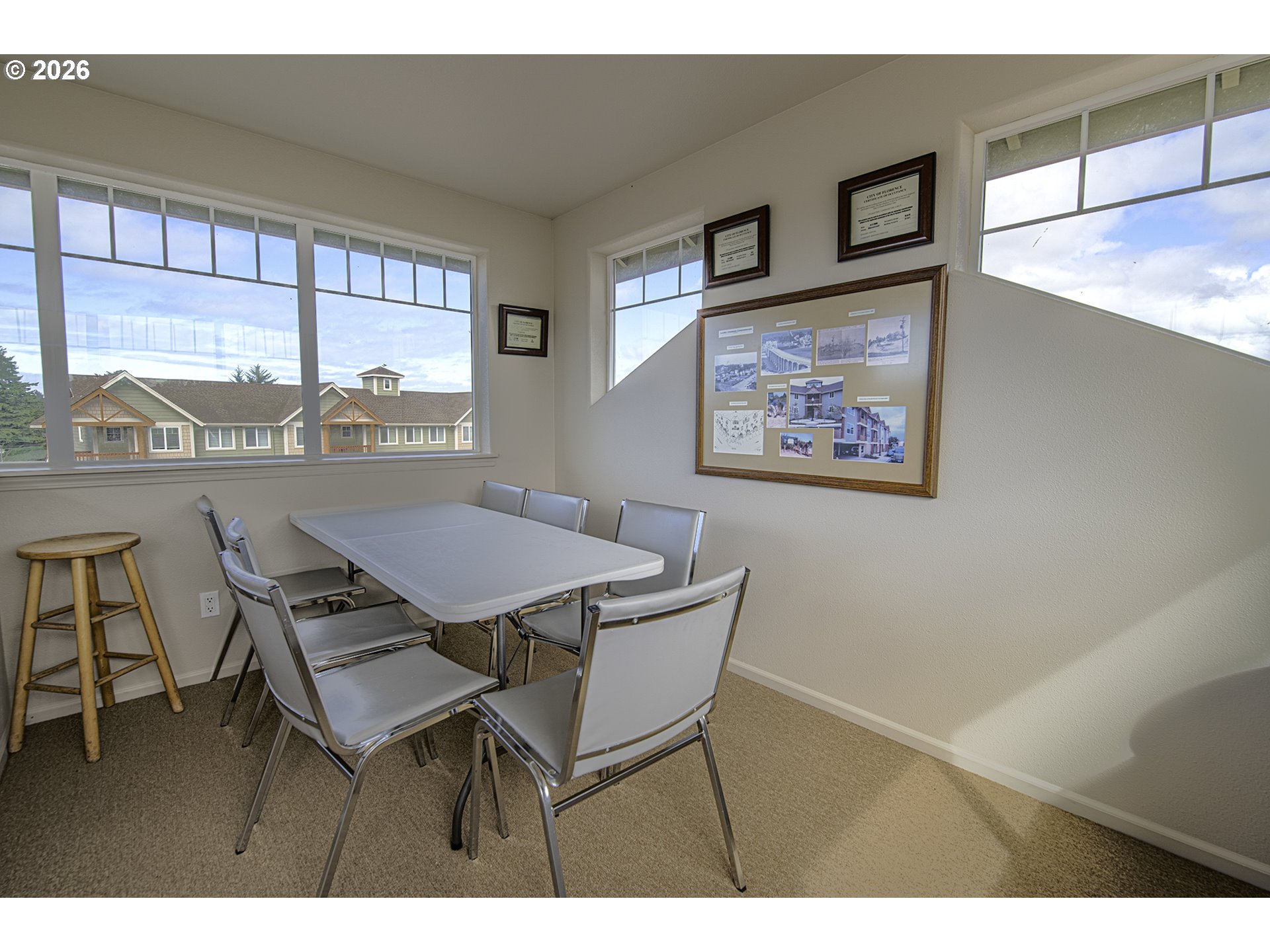 179 Laurel Street, Unit 9 Florence, OR 97439 - Photo 37 of 37 a view of a dining room with furniture large window and outside view