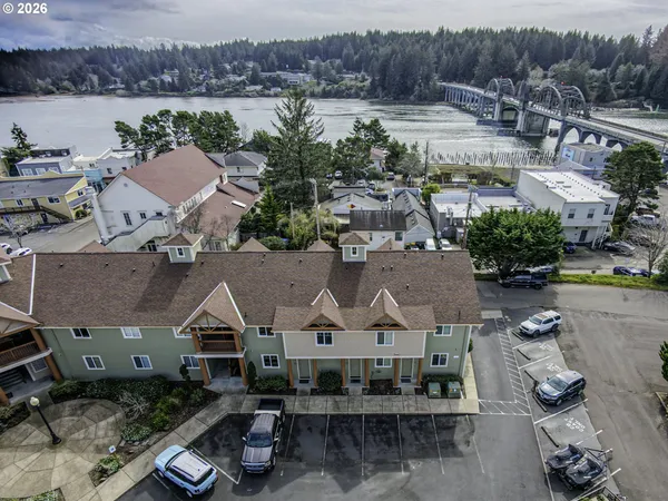 an aerial view of a house with a lake view and a mountain view