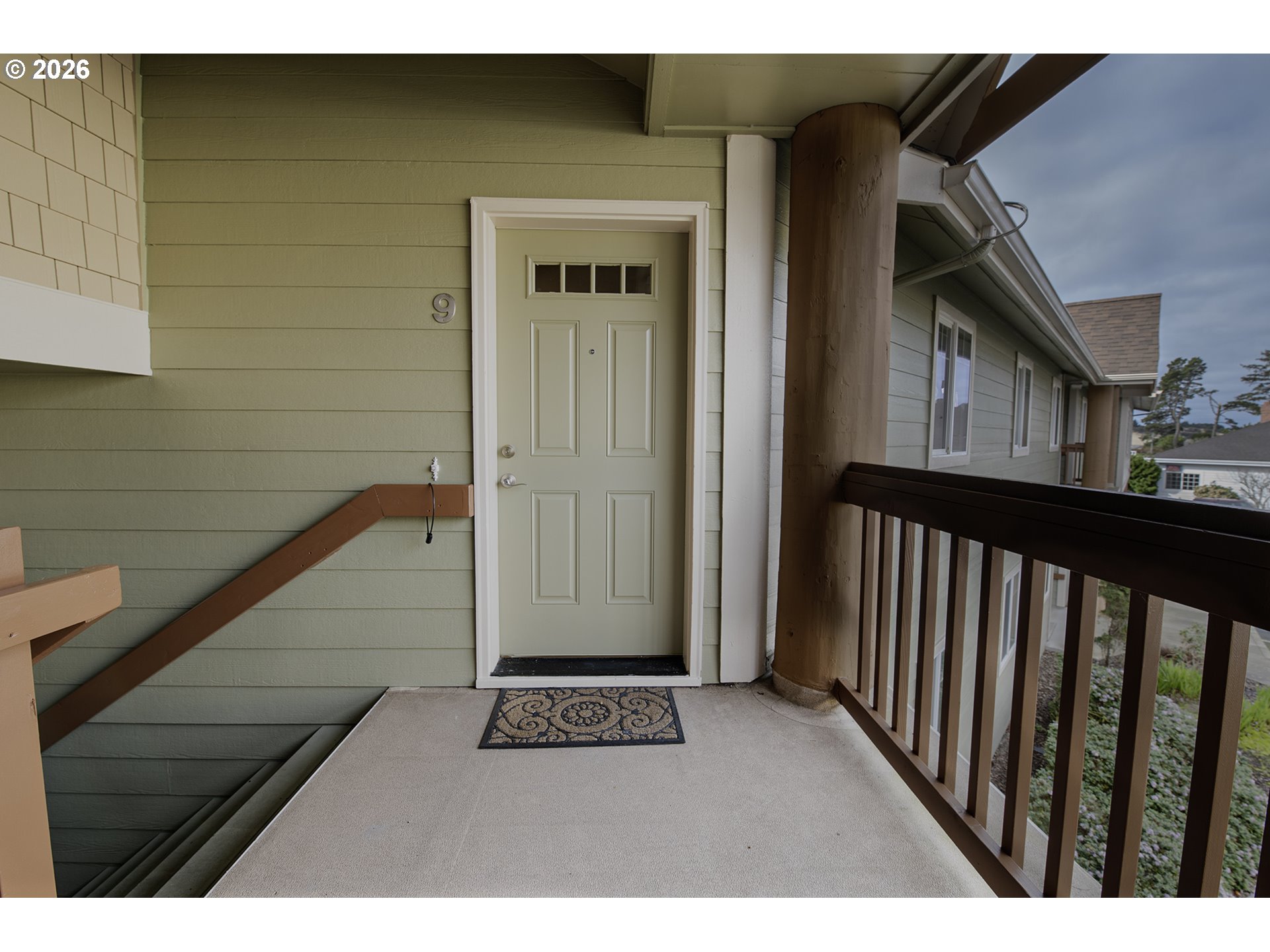 179 Laurel Street, Unit 9 Florence, OR 97439 - Photo 6 of 37 a view of balcony and door