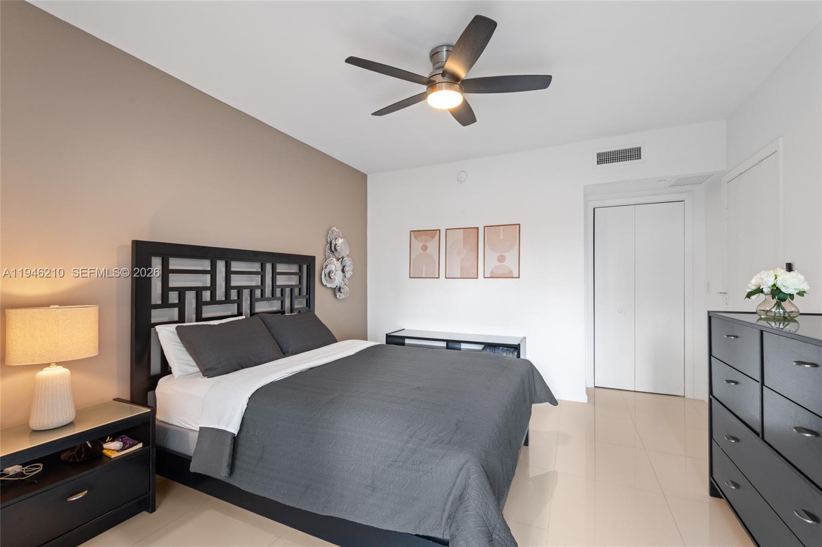465 Brickell Avenue, Unit 904 Miami, FL 33131 - Photo 14 of 21 a bedroom with a bed and a window