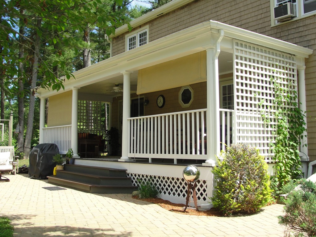133 Walnut Plain Road Rochester, MA 02770 - Photo 5 of 30 a view of a house with a small yard and wooden fence and wooden fence