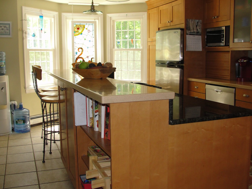 133 Walnut Plain Road Rochester, MA 02770 - Photo 8 of 30 a kitchen with stainless steel appliances a sink a stove and a refrigerator