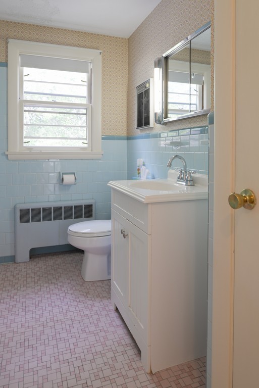 83 Lafayette Street Marblehead, MA 01945 - Photo 13 of 25 a bathroom with a sink toilet and mirror