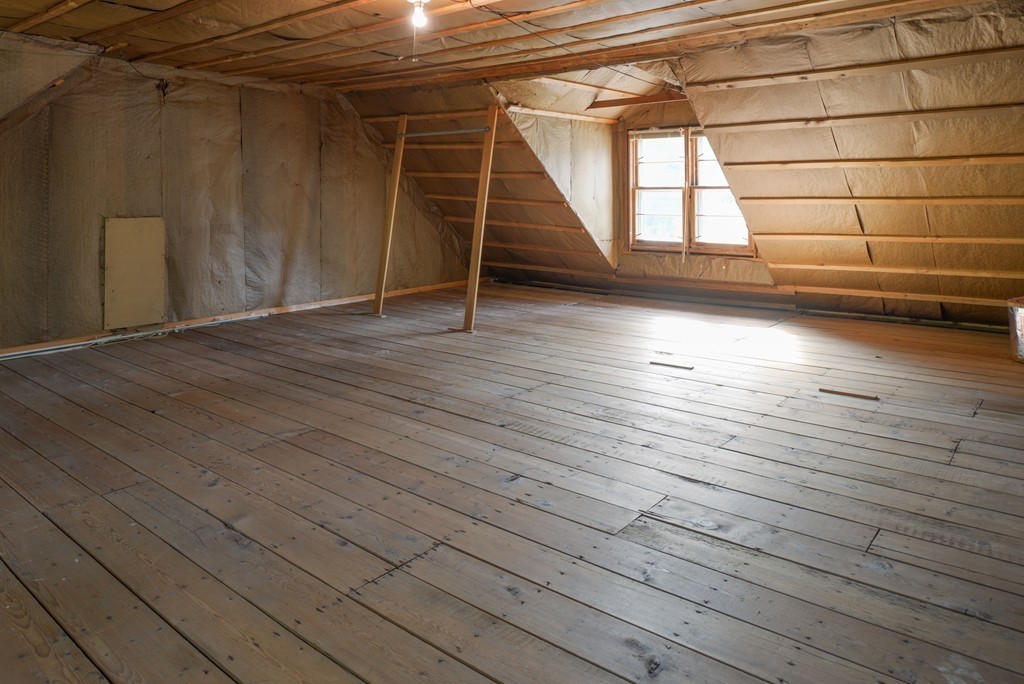 83 Lafayette Street Marblehead, MA 01945 - Photo 16 of 25 an empty room with wooden floor and windows