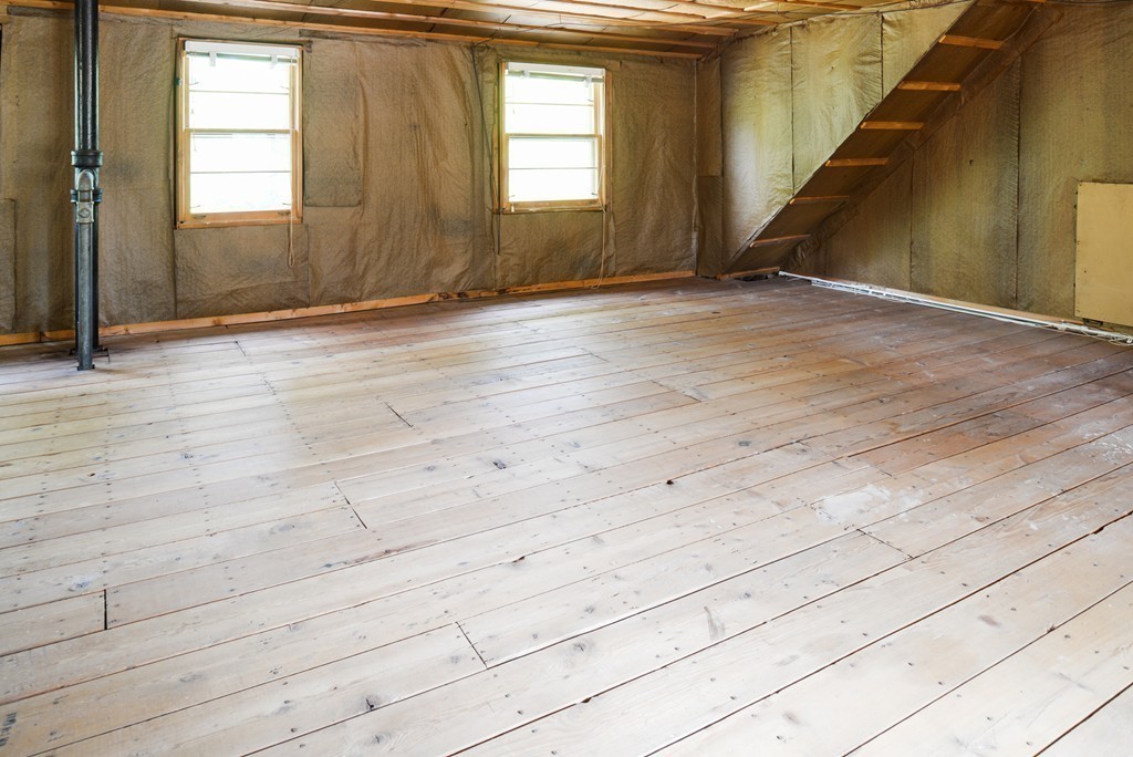 83 Lafayette Street Marblehead, MA 01945 - Photo 18 of 25 a view of an empty room with wooden floor and a window