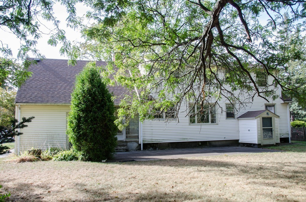 83 Lafayette Street Marblehead, MA 01945 - Photo 22 of 25 a view of a white house with a large tree