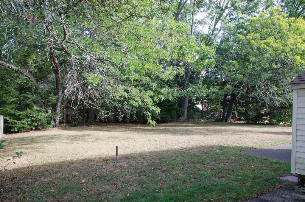 83 Lafayette Street Marblehead, MA 01945 - Photo 23 of 25 a white house with trees in the background