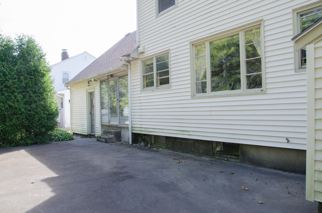 83 Lafayette Street Marblehead, MA 01945 - Photo 25 of 25 a view of a house with backyard and garden