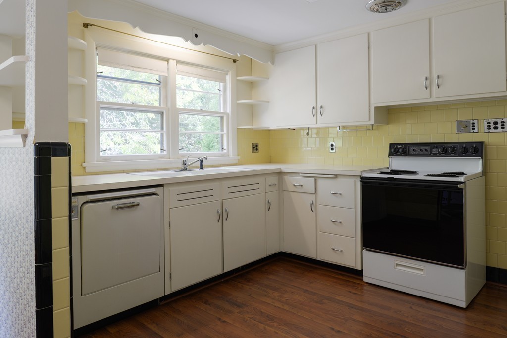 83 Lafayette Street Marblehead, MA 01945 - Photo 6 of 25 a kitchen with appliances cabinets and a sink