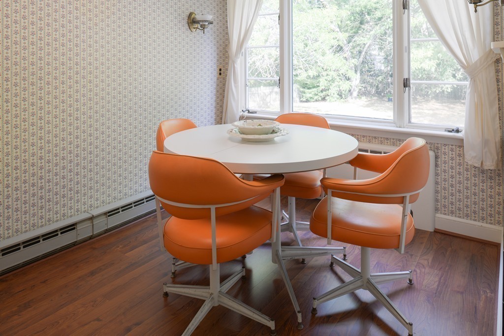 83 Lafayette Street Marblehead, MA 01945 - Photo 9 of 25 a dining room with furniture and wooden floor