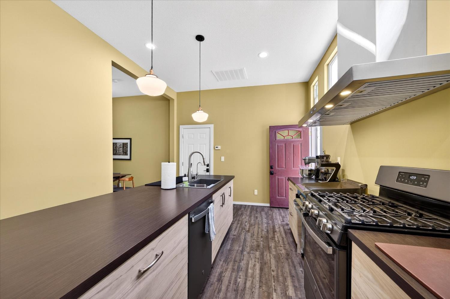 43 Main Street Isleton, CA 95641 - Photo 6 of 25 a kitchen with a stove and a wooden floor