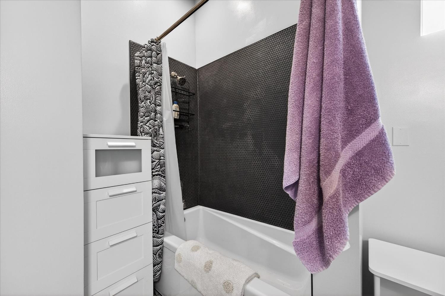 43 Main Street Isleton, CA 95641 - Photo 9 of 25 a bathroom with a bathtub and shower