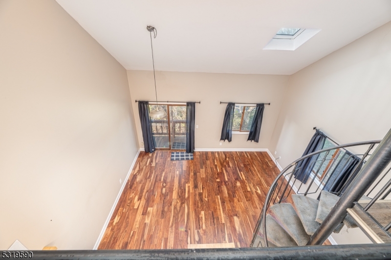 5 Sugar Loaf Court, Unit 7 Vernon, NJ 07462 - Photo 11 of 20 a bedroom with a bed and wooden floor