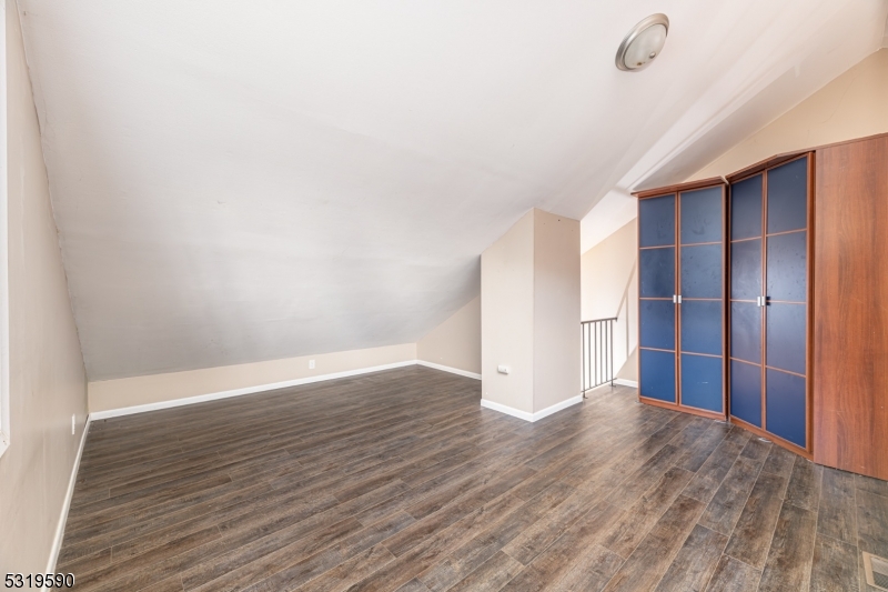 5 Sugar Loaf Court, Unit 7 Vernon, NJ 07462 - Photo 13 of 20 a view of an empty room with wooden floor and closet