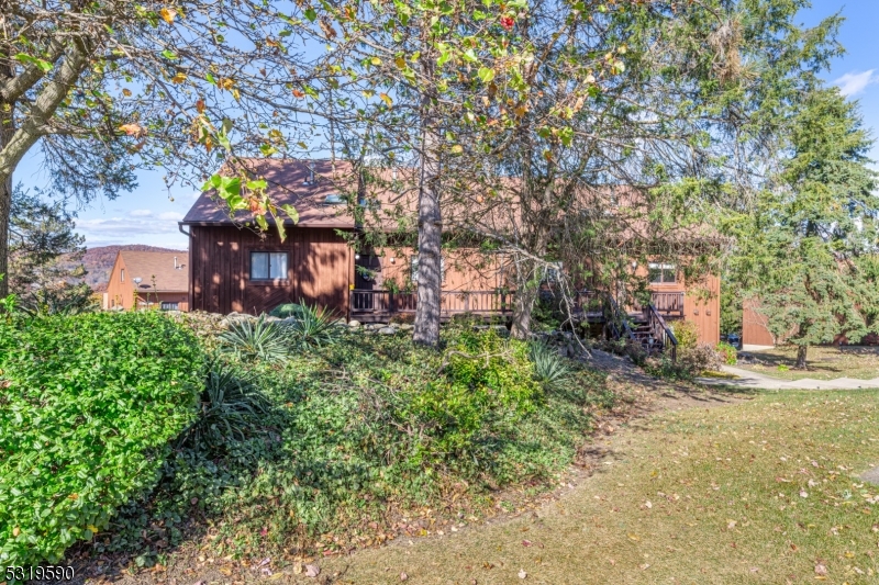 5 Sugar Loaf Court, Unit 7 Vernon, NJ 07462 - Photo 18 of 20 a view of a house with a large tree and a yard