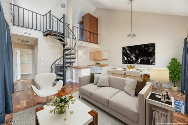 a living room with furniture fireplace and flat screen tv