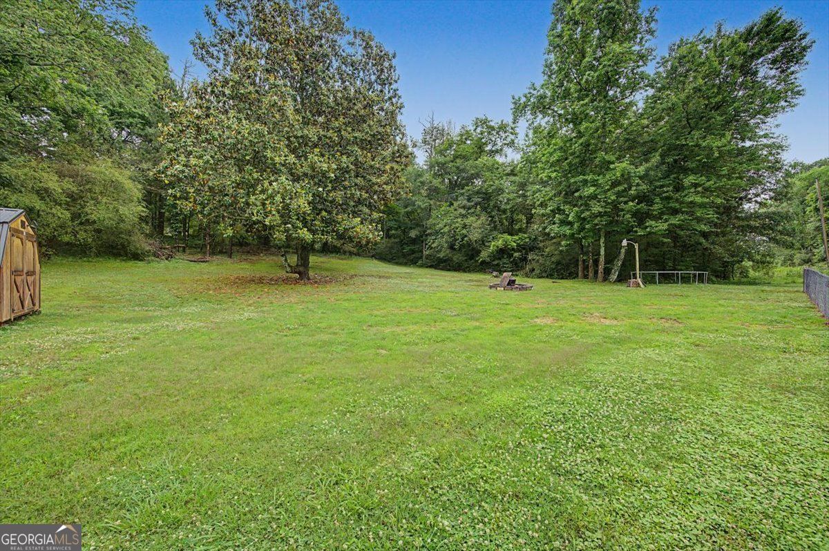 483 Coal Road Northwest Resaca, GA 30735 - Photo 46 of 56 a backyard of a house with lots of green space