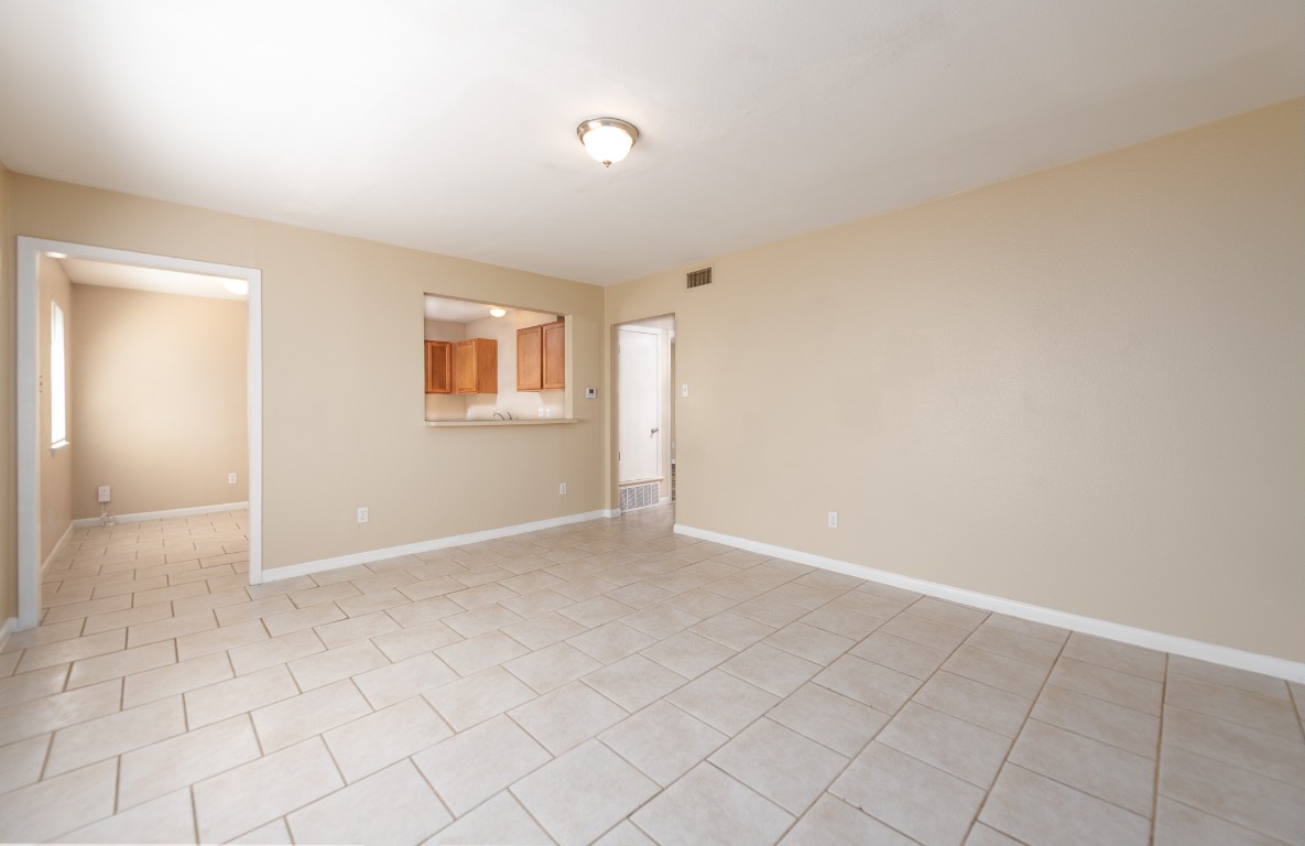 7300 Twin Crest Drive, Unit 202 Austin, TX 78752 - Photo 2 of 12 an empty room with windows
