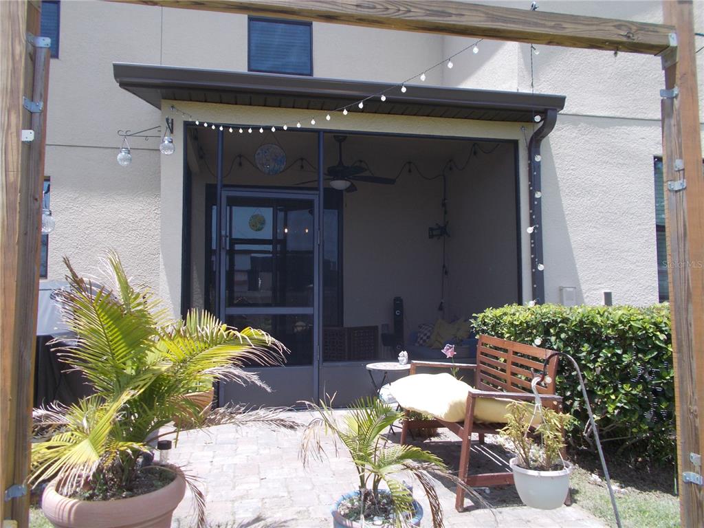 2406 Seven Oaks Drive St. Cloud, FL 34772 - Photo 11 of 11 a couple of potted plants in front of door