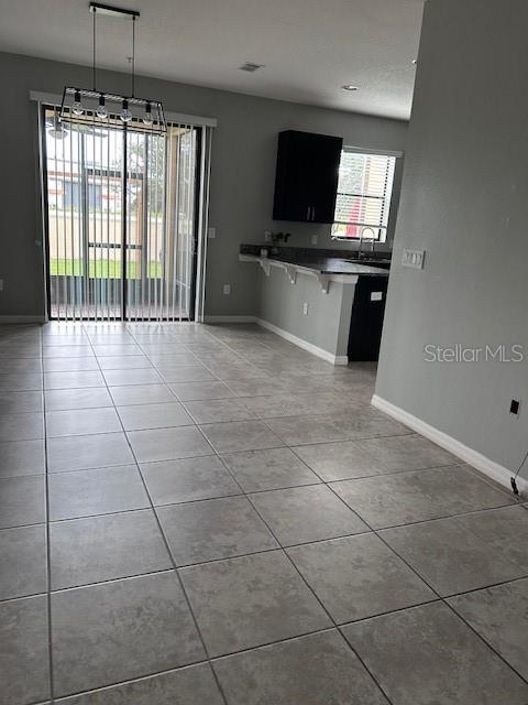 2406 Seven Oaks Drive St. Cloud, FL 34772 - Photo 3 of 11 a view of a livingroom with furniture flat screen tv and windows