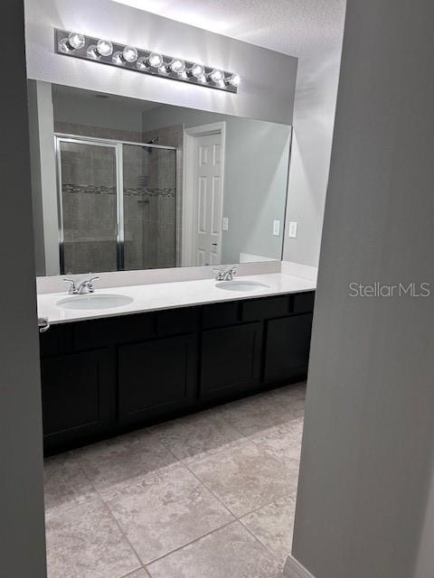 2406 Seven Oaks Drive St. Cloud, FL 34772 - Photo 10 of 11 a bathroom with a sink and a mirror