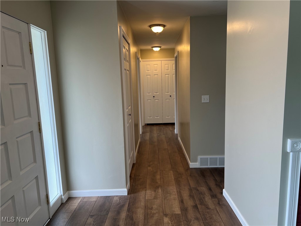 1715 Toepfer Road Akron, OH 44312 - Photo 12 of 49 Hallway featuring dark wood-type flooring