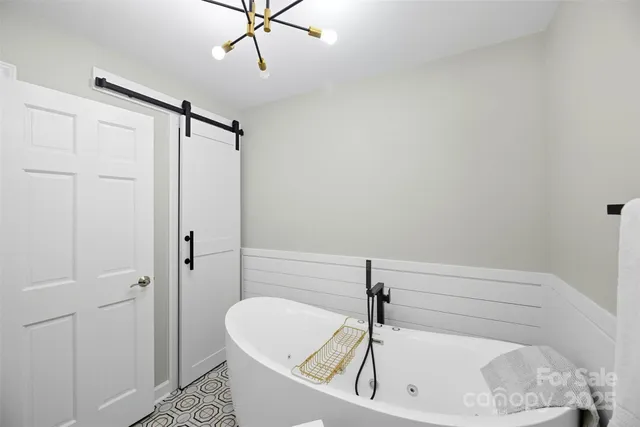 a bathroom with a tub and shower