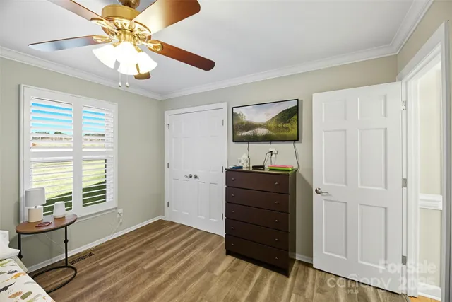 a room with a bed and a window