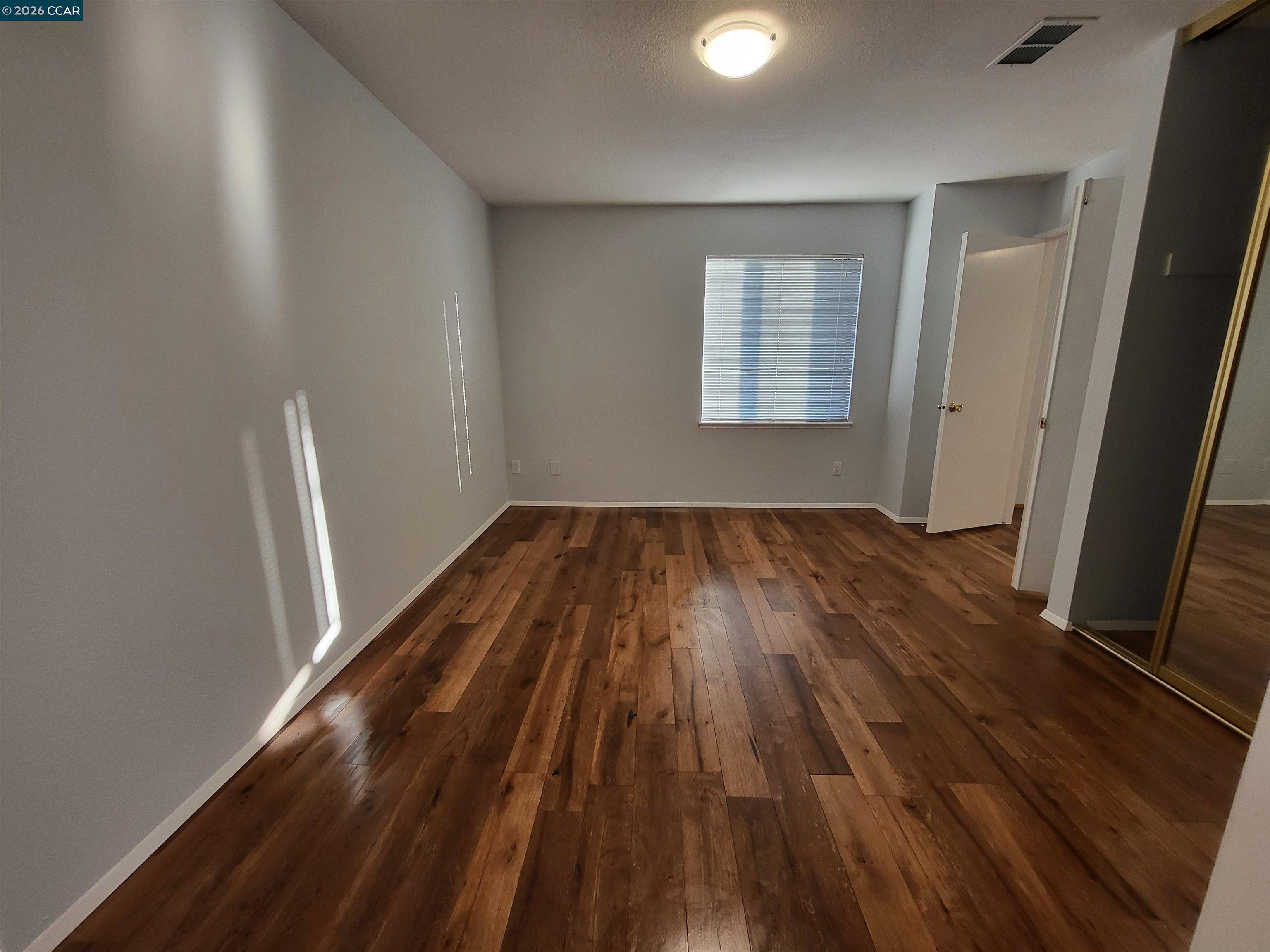 11 Range Court Hercules, CA 94547 - Photo 11 of 18 a view of room with window and wooden floor