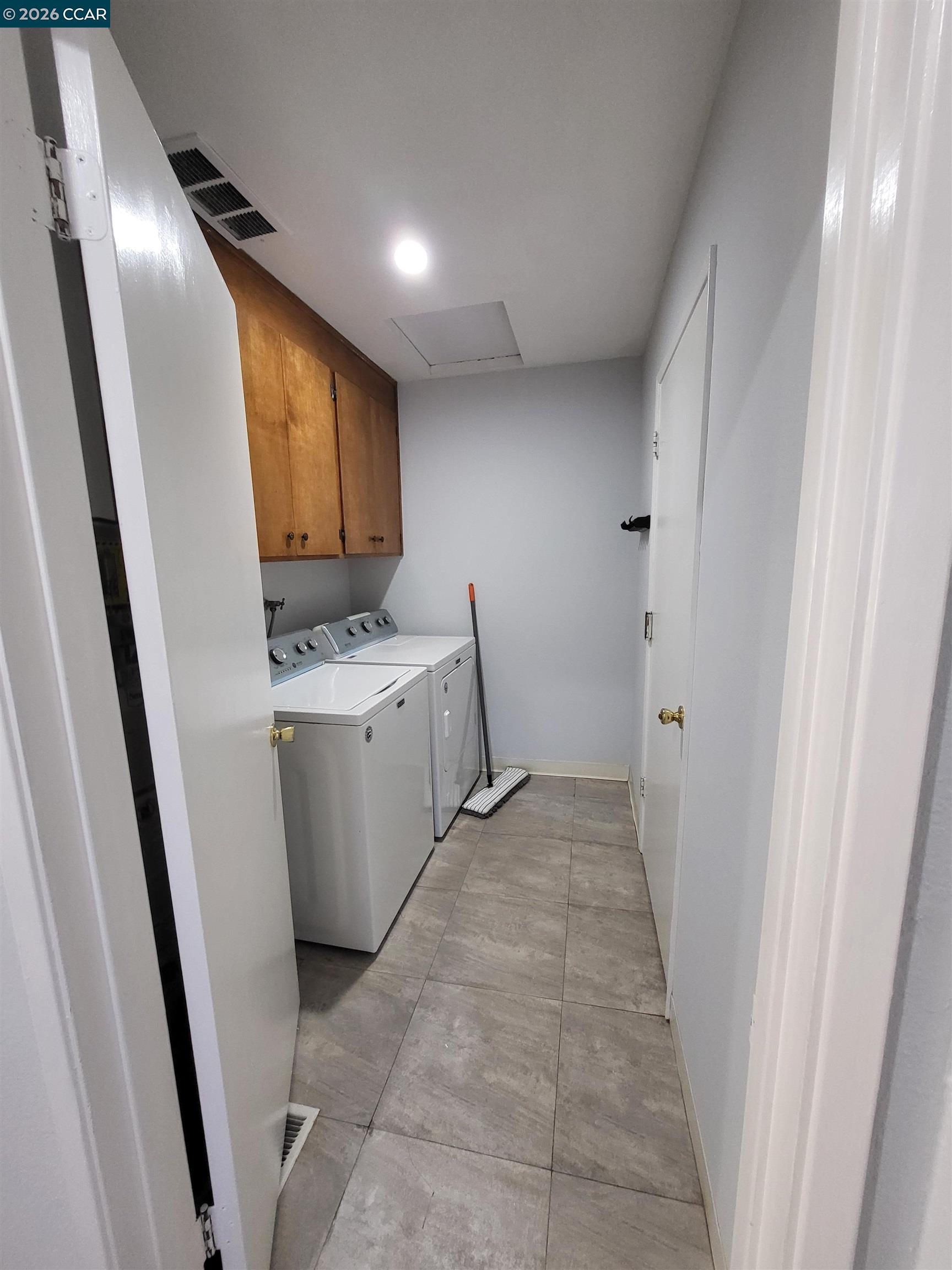 11 Range Court Hercules, CA 94547 - Photo 9 of 18 a view of a hallway with washer and dryer
