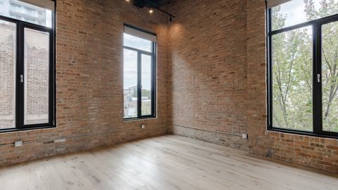 729 North Sangamon Street, Unit 401 Chicago, IL 60642 - Photo 13 of 38 an empty room with windows