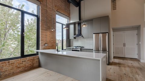 729 North Sangamon Street, Unit 401 Chicago, IL 60642 - Photo 2 of 38 a view of a bathroom with a bathtub and a sink