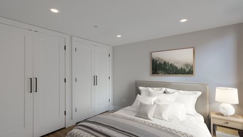 729 North Sangamon Street, Unit 401 Chicago, IL 60642 - Photo 23 of 38 a bedroom with a bed and a painting on the wall
